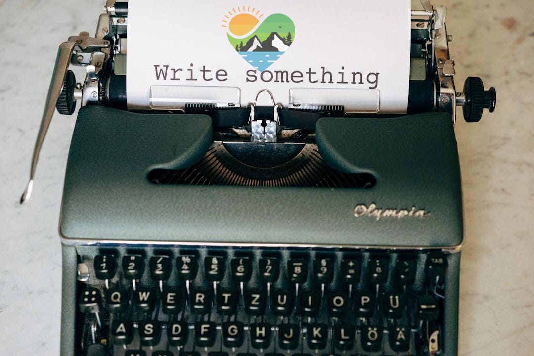 black and white typewriter on green table