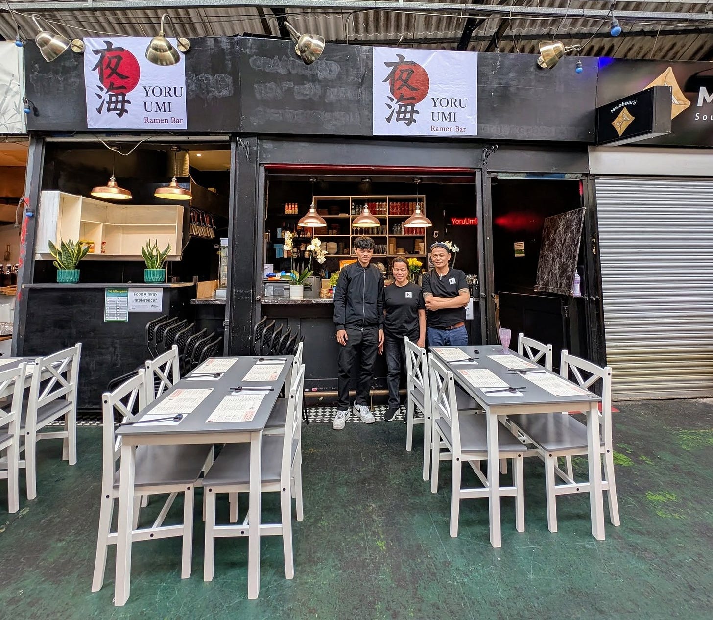 May be an image of 3 people and text