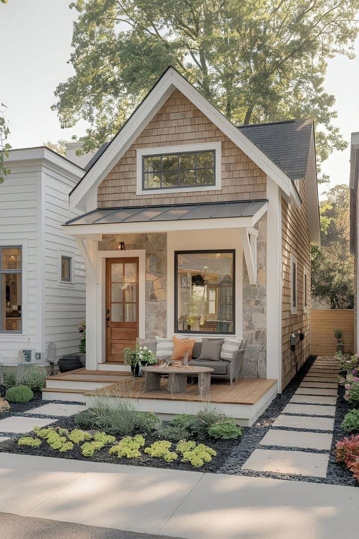 This may contain: a small house with a porch and patio