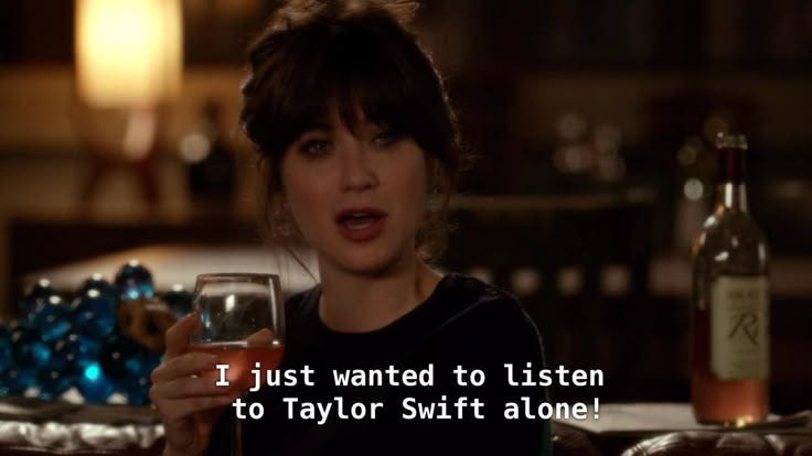 This may contain: a woman holding a wine glass in her hand