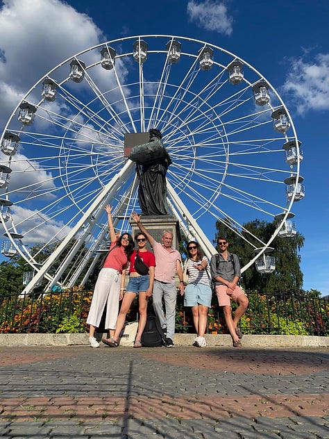 On the left, five people standing in front of a Ferris wheel in Geneva, Switzerland. Two have their hands raised. In the middle, the ceiling of the St. Gallen cathedral, featuring three huge vaults and a dark fresco. The moulding is pink and green. On the right, a goat or antelope rubbing its large horns against a tree in a rocky enclosure.