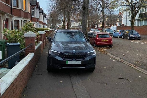 A resident in Cardiff shared this picture of an electric vehicle being charged while parked on a pavement A resident in Cardiff shared this picture of an electric vehicle being charged while parked on a pavement