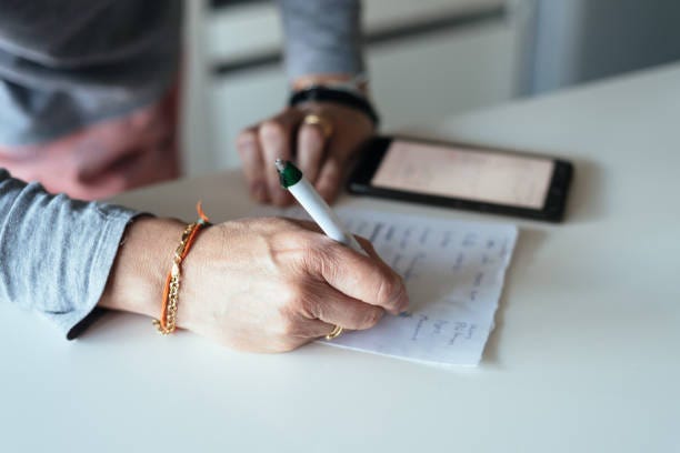 https://media.istockphoto.com/id/1217796460/photo/woman-making-a-shopping-list-in-the-kitchen.jpg?s=612x612&w=0&k=20&c=8tdN4dXz4S7pmmy6Kue71mnb1_hILk2LEBNWgwFHMEQ=