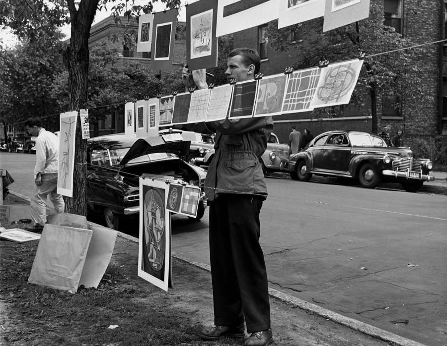 May be a black-and-white image of one or more people, street, crowd and text