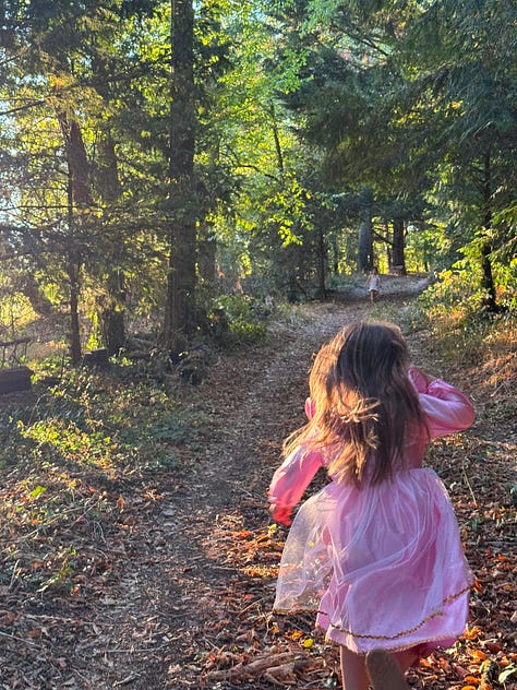 A grid of six summer photos. Top row: a boy kicking a soccer ball in a tree-lined field; a young girl paddling a small inflatable kayak on a river beneath a stone arched bridge; a girl in a pink fairy dress walking a sun-dappled forest path. Bottom row: a girl sitting on a leafy forest slope doing a beading craft; a child rowing a small boat on a calm green river; a boy and girl painting with watercolors at a table set with brushes and a star-patterned cloth.