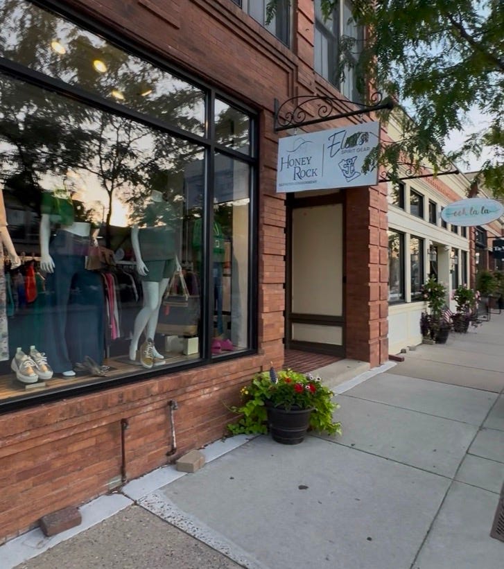 A storefront with a sign
Description automatically generated A storefront with a sign
Description automatically generated