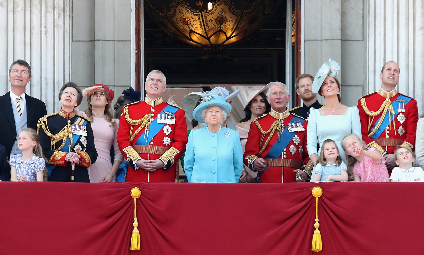 The Royal Family looking up on the balcony of Buckingham Palace