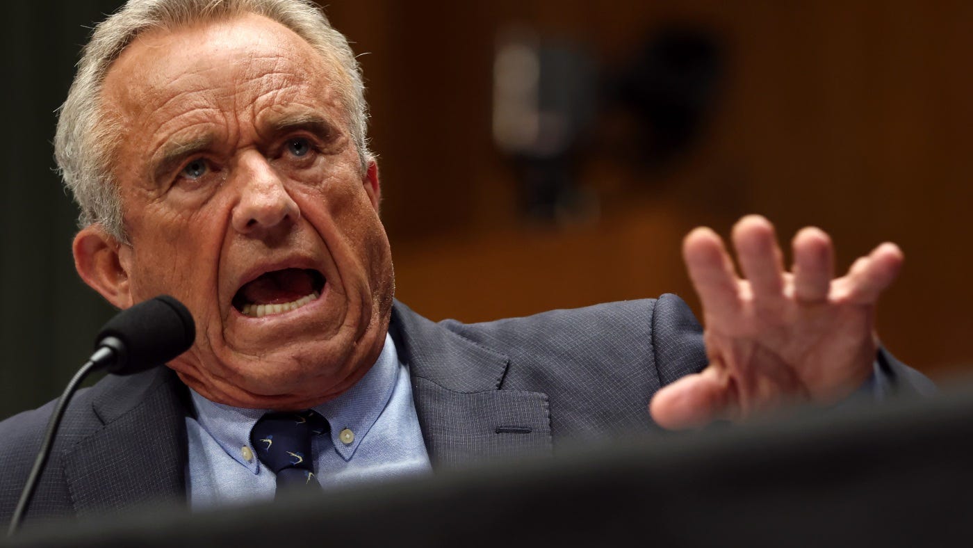 Health and Human Services Secretary Robert F. Kennedy Jr. speaks animatedly during congressional testimony, leaning forward toward the microphone with his hand raised in an emphatic gesture while testifying before the Senate committee. Health and Human Services Secretary Robert F. Kennedy Jr. speaks animatedly during congressional testimony, leaning forward toward the microphone with his hand raised in an emphatic gesture while testifying before the Senate committee.