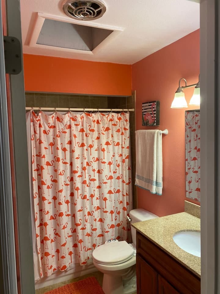 The Flamingo bathroom. It is shared with you and possibly other guests. It is located in the Guests hallway.