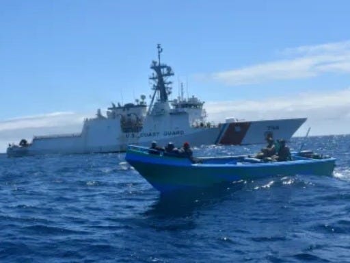 US Coast Guard Cutter Stone alongside a seized cartel smuggling boat in the Eastern Pacific Ocean on August 17, 2025