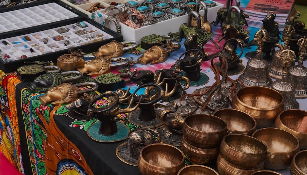 a table topped with lots of metal cups and bowls