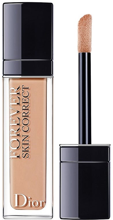 Product shot of the Dior Forever Skin Correct Concealer. It is shown in a large tube with the doe foot wand by the side. and illustrating its liquid-cream formula designed for full-coverage and larger areas.