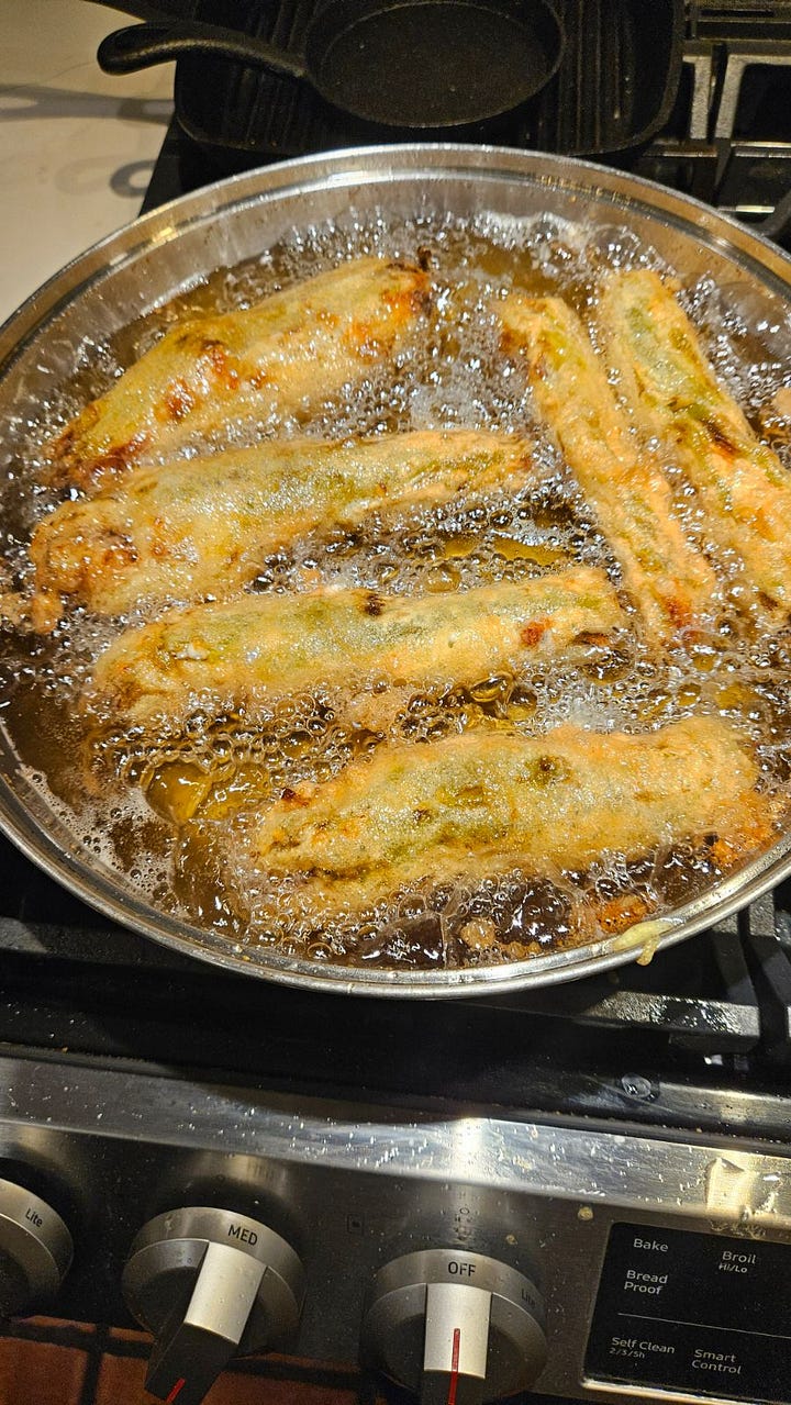 Dustin preparing his famous chili rellenos
