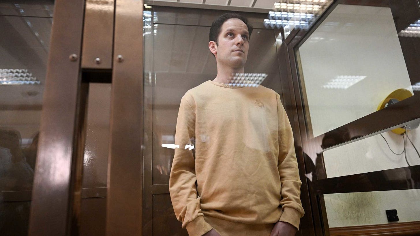 Evan Gershkovich stands inside a defendants' cage before a hearing in Moscow on Tuesday. Evan Gershkovich stands inside a defendants' cage before a hearing in Moscow on Tuesday.