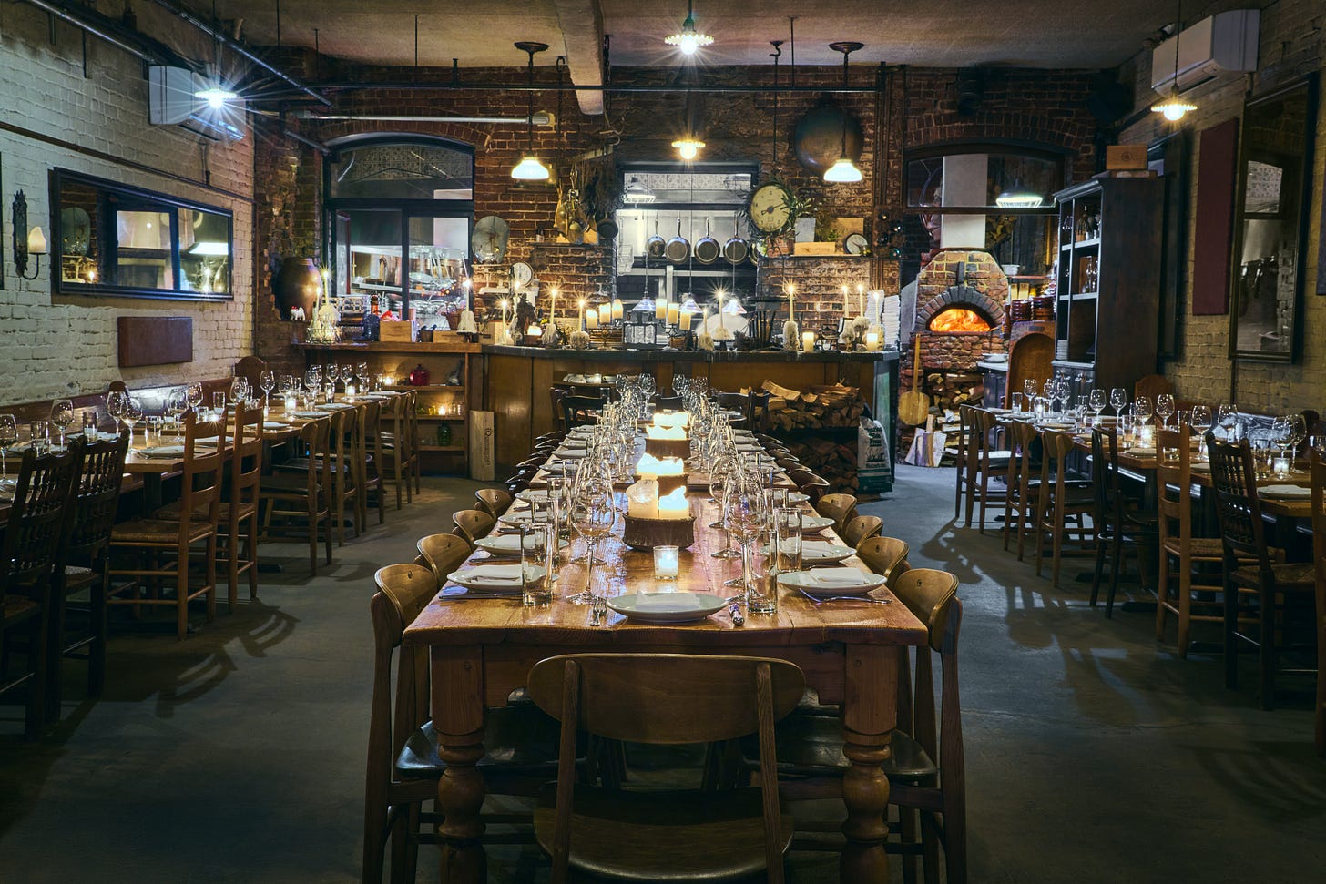 long wooden table set for service at Peasant