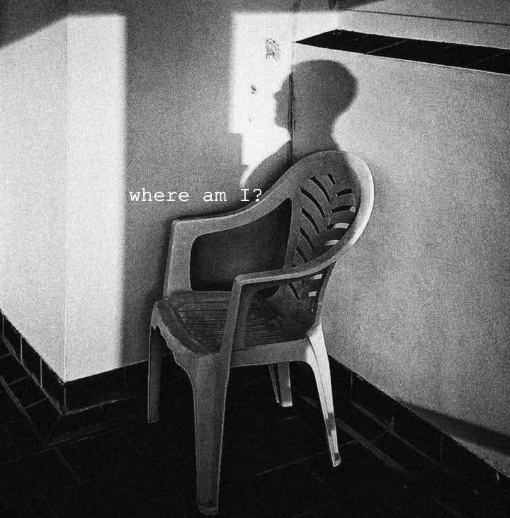 This may contain: a black and white photo of a chair next to a counter