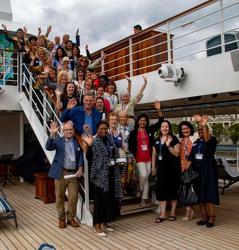 A group of nearly 40 food writers on the staircase; writer, artist, muse Elizabeth Luard on a golden double-helix staircase; Bruce pointing out the Star Legend