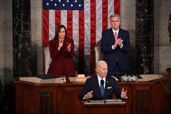 President Joe Biden delivers his State of the Union address, with Vice President Kamala and Speaker Kevin McCarthy standing behind him applauding