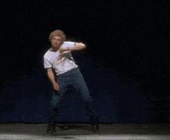 Movie gif. Jon Heder as Napoleon in Napoleon Dynamite dances a choreographed dance on stage, putting his whole body and energy into it, reaching his arms in every direction, while wearing his snow boots. Movie gif. Jon Heder as Napoleon in Napoleon Dynamite dances a choreographed dance on stage, putting his whole body and energy into it, reaching his arms in every direction, while wearing his snow boots.