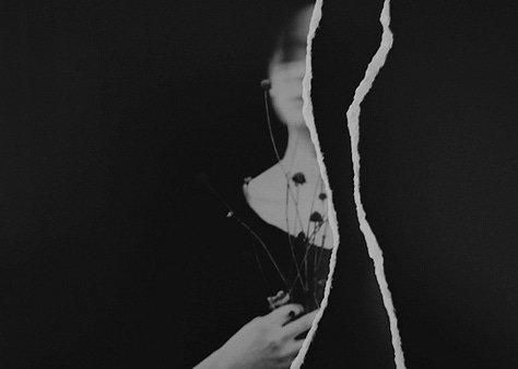 Portrait of a person in a torn up image holding dried flowers, with tape over her eyes, and with tape over her mouth.