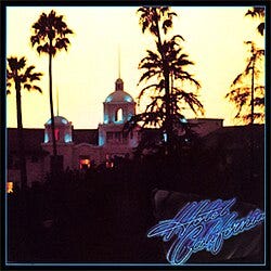 The Eagles “Hotel California” album cover: the Beverly Hills Hotel under palm trees at dusk. The Eagles “Hotel California” album cover: the Beverly Hills Hotel under palm trees at dusk.