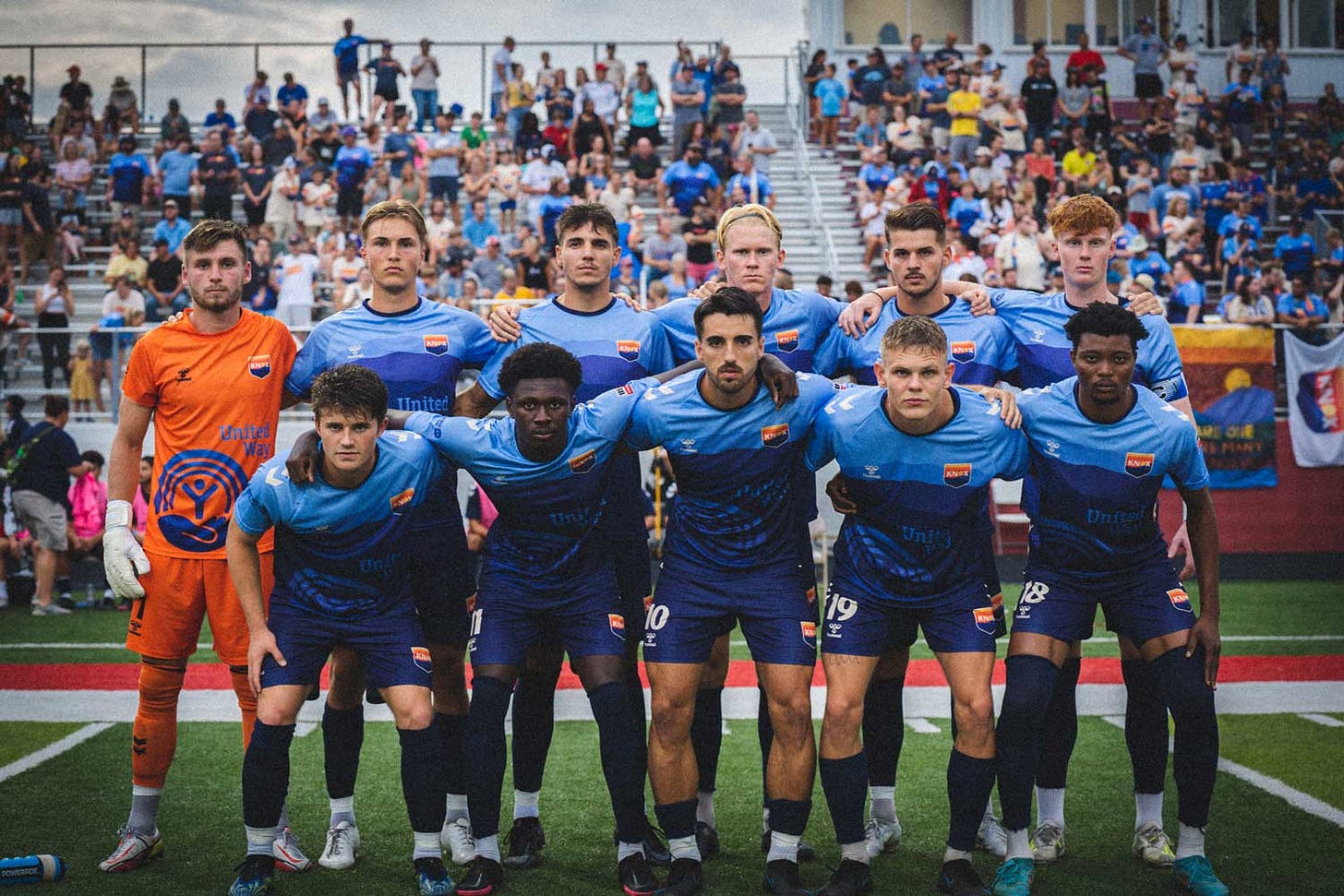 Players lined up before the start of the game. Players lined up before the start of the game.