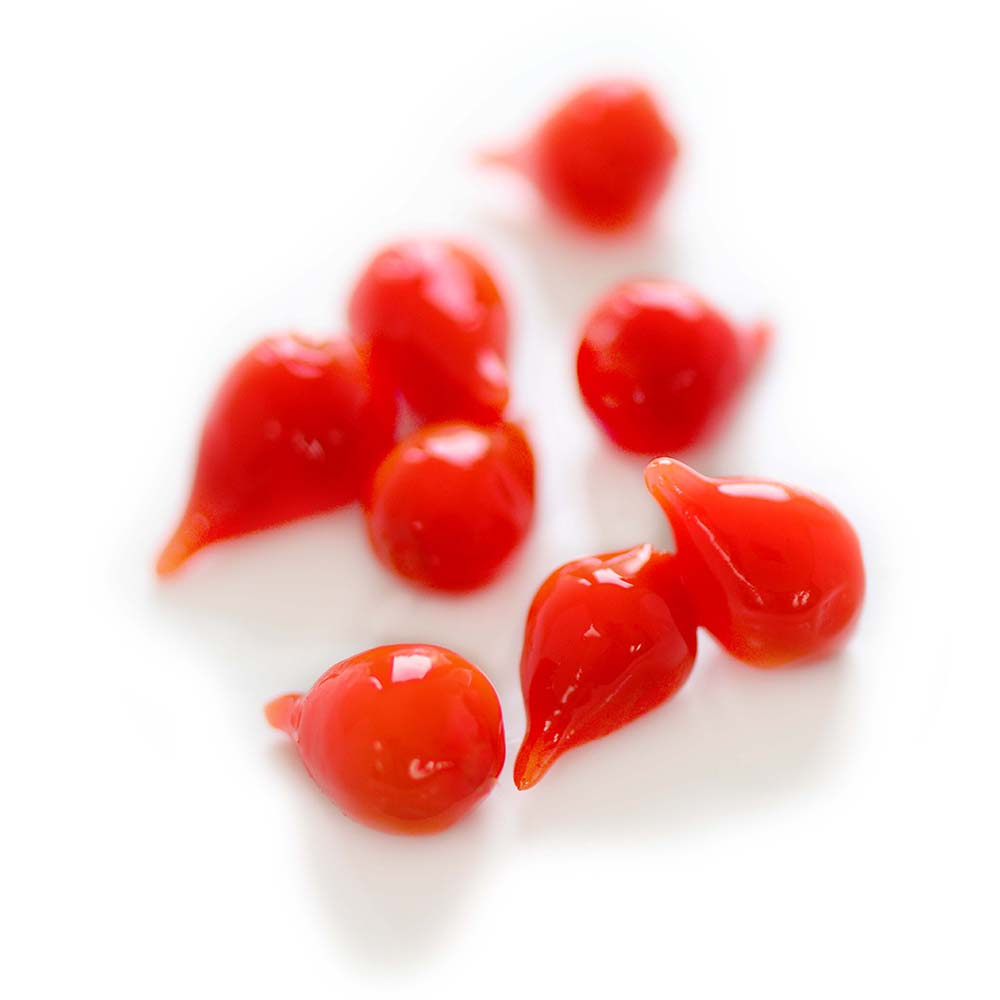 A close-up photo of several sweety drop peppers