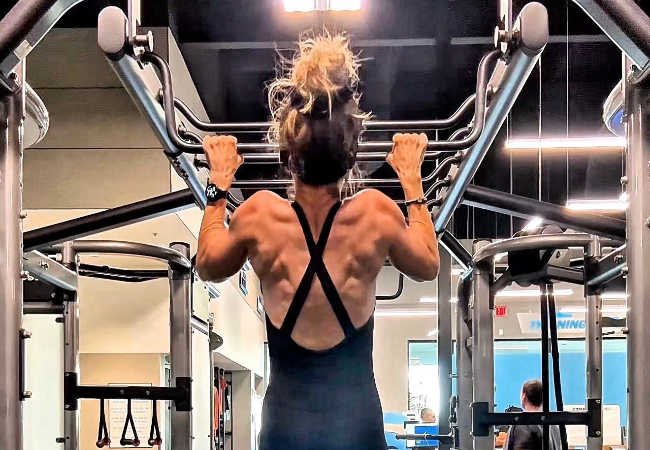 Lorraine C. Ladish doing pullups at 62