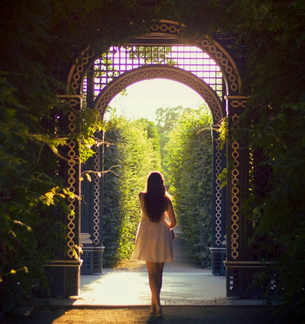 woman walking alone on pathway woman walking alone on pathway