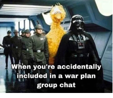 A group of people in a room with a character in front of them
AI-generated content may be incorrect.