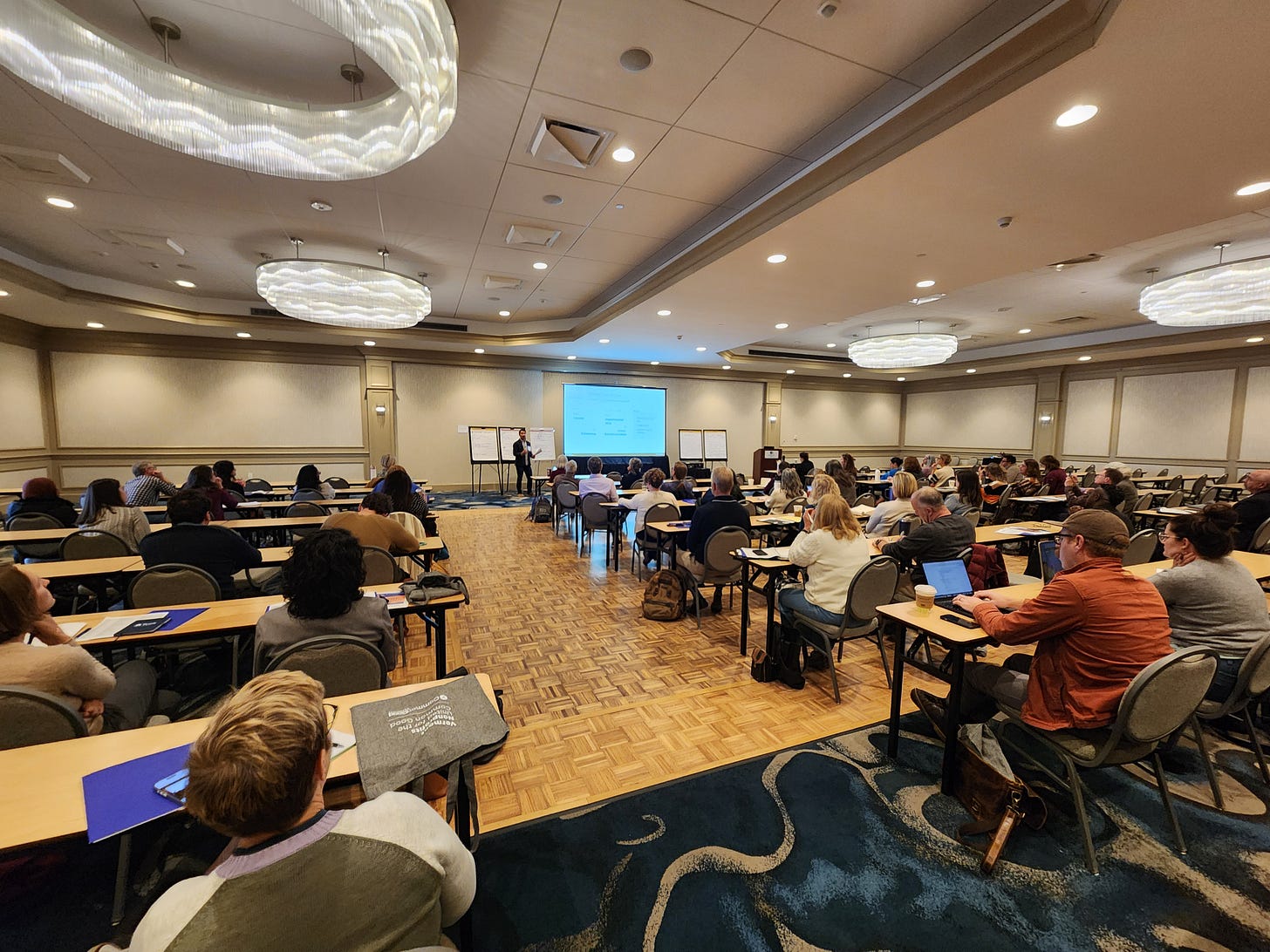 Wide-angle picture of me presenting at the 2025 Vermont Nonprofit Summit. 