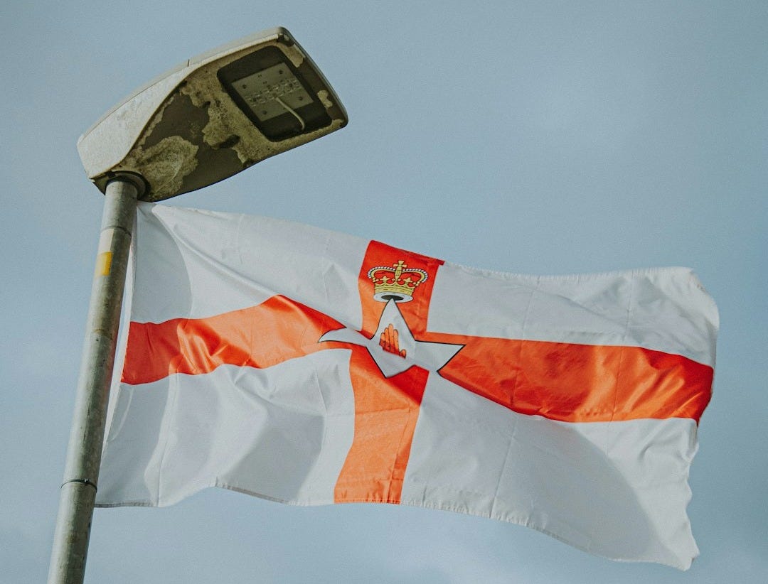 an orange and white flag flying in the wind an orange and white flag flying in the wind