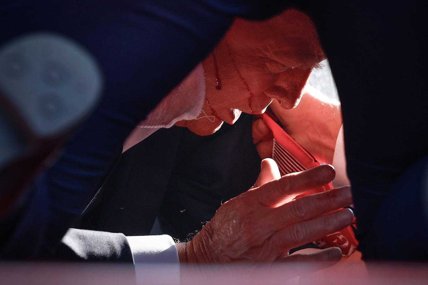 Donald Trump Injured During Shooting At Campaign Rally In Butler, PA Former President Donald Trump is shown covered by U.S. Secret Service agents after an assassination attempt during a rally for the Republican presidential candidate in Butler, Pa., on July 13.Anna Moneymaker—Getty Images.