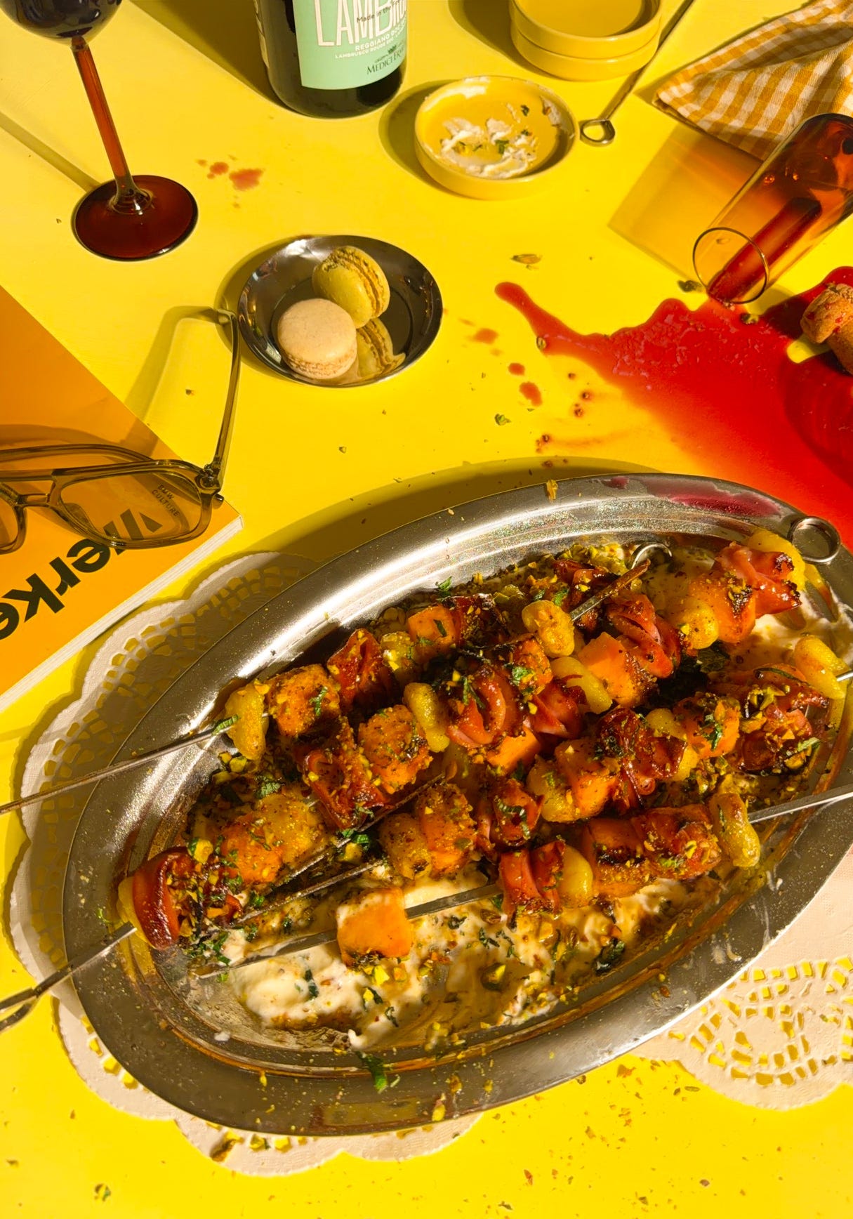 trashy editorial food: grilled mortadella and gnocchi skewers with charred cantaloupe over whipped ricotta on a silver platter. trashy editorial food: grilled mortadella and gnocchi skewers with charred cantaloupe over whipped ricotta on a silver platter.
