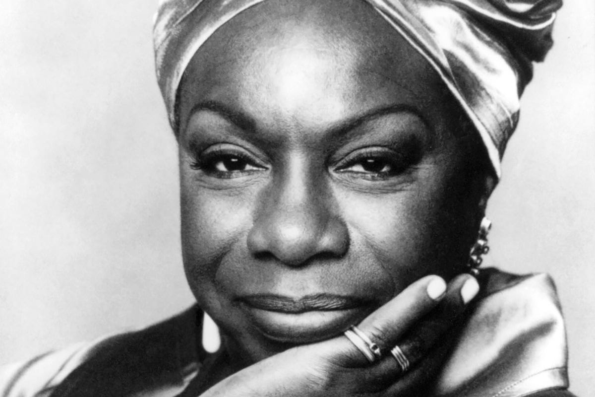 Black-and-white portrait of singer, songwriter, and civil rights activist Nina Simone looking toward the camera.