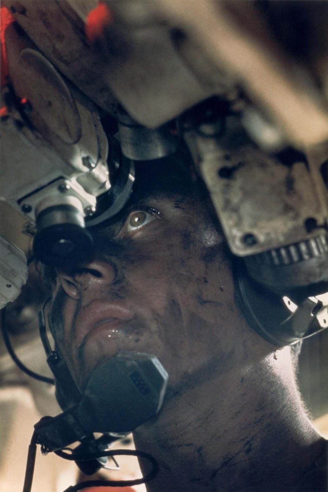 The commander of an M48 Patton tank surveying the battlefield during the Vietnam War, 1967.