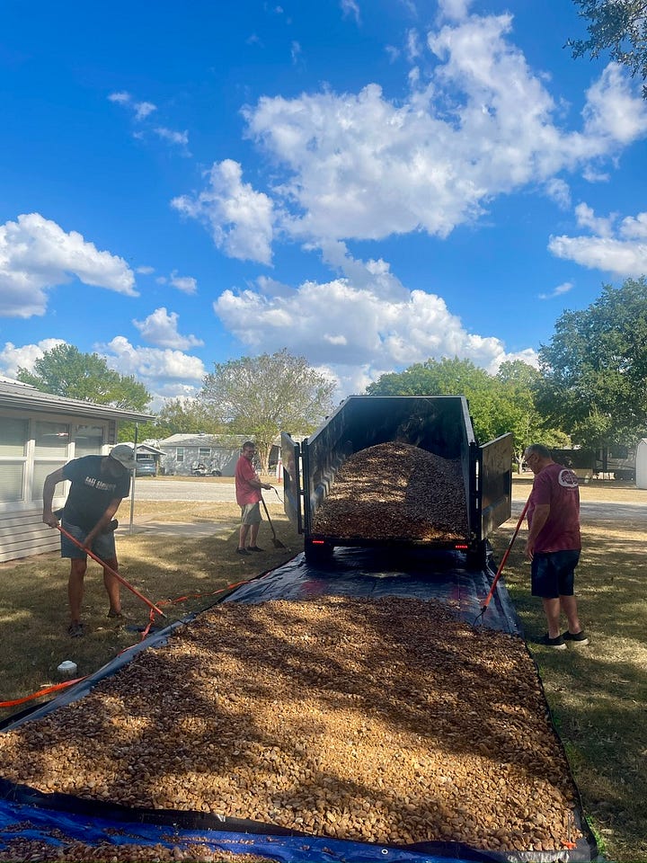 Photos of the rock delivery and helping hands spreading it.