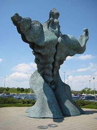 A statue of a person

AI-generated content may be incorrect.