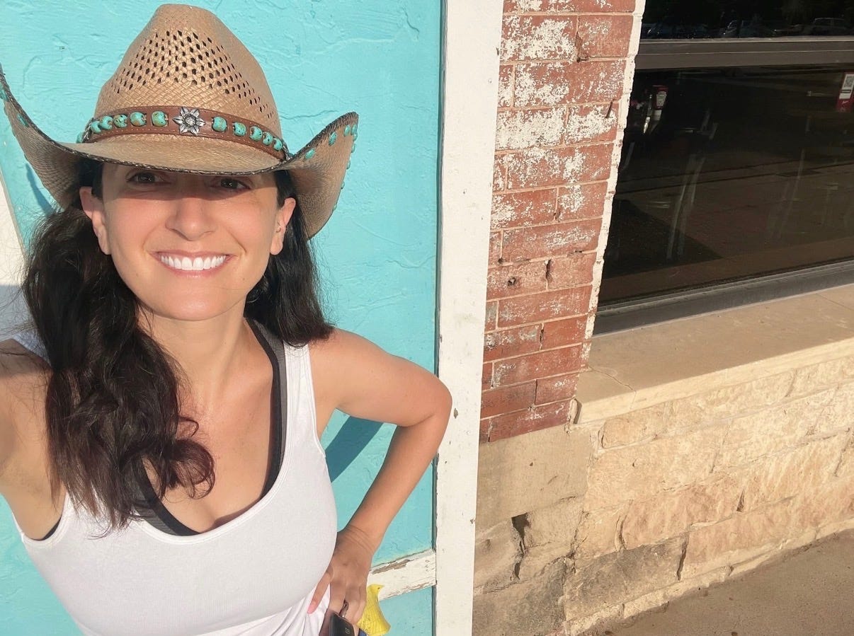 Diana Spechler wearing a brown cowboy hat over her long dark wavy hair Diana Spechler wearing a brown cowboy hat over her long dark wavy hair