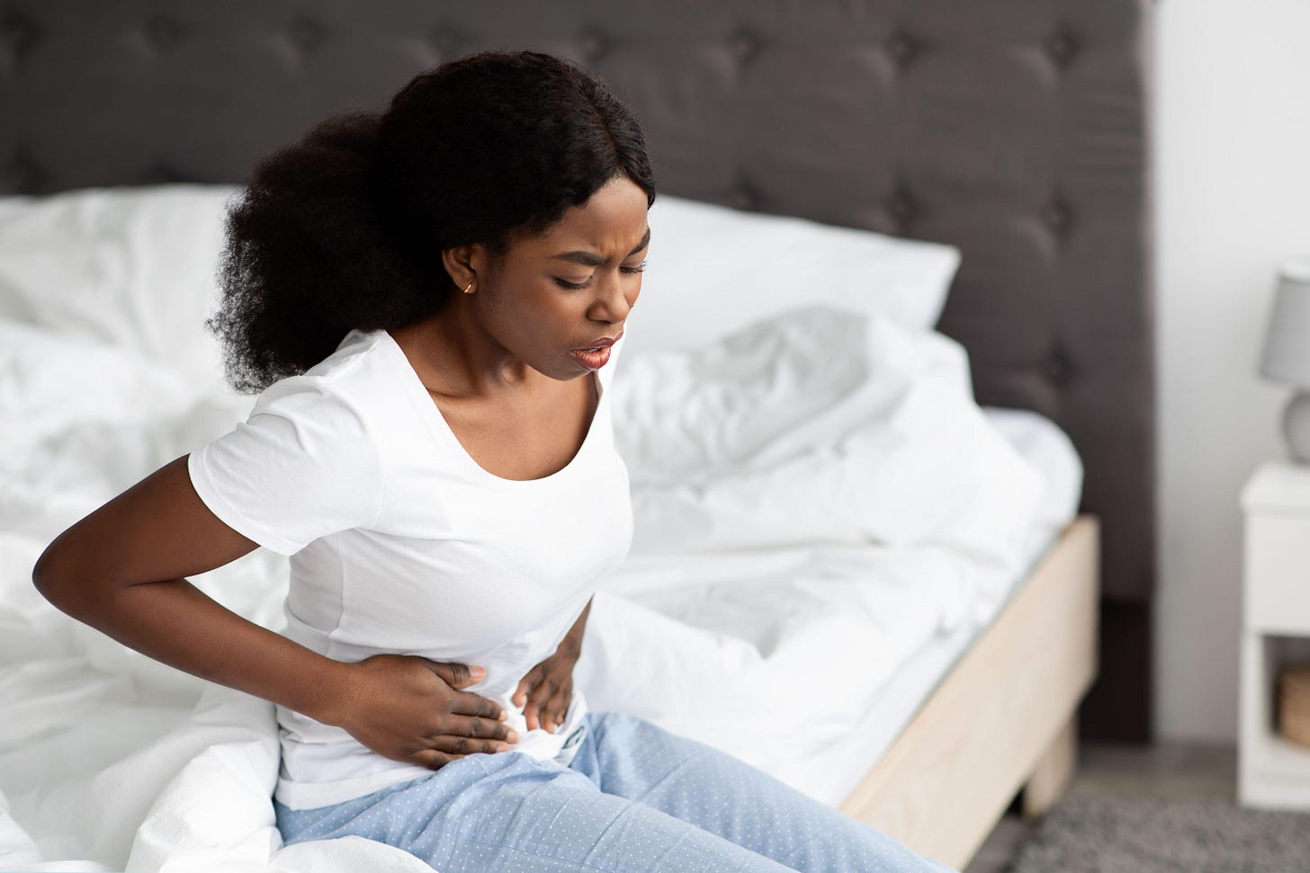 woman suffering from abdominal pain