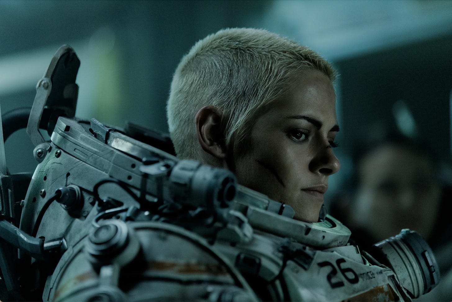 Kristen Stewart in short blonde hair and diving suit