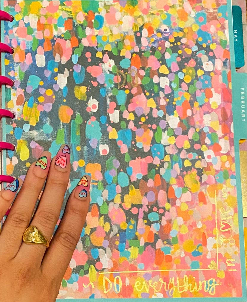 February page of a My Happy Planner with 1 Corinthians 16:14 Do everything in love calligraphed in gold.