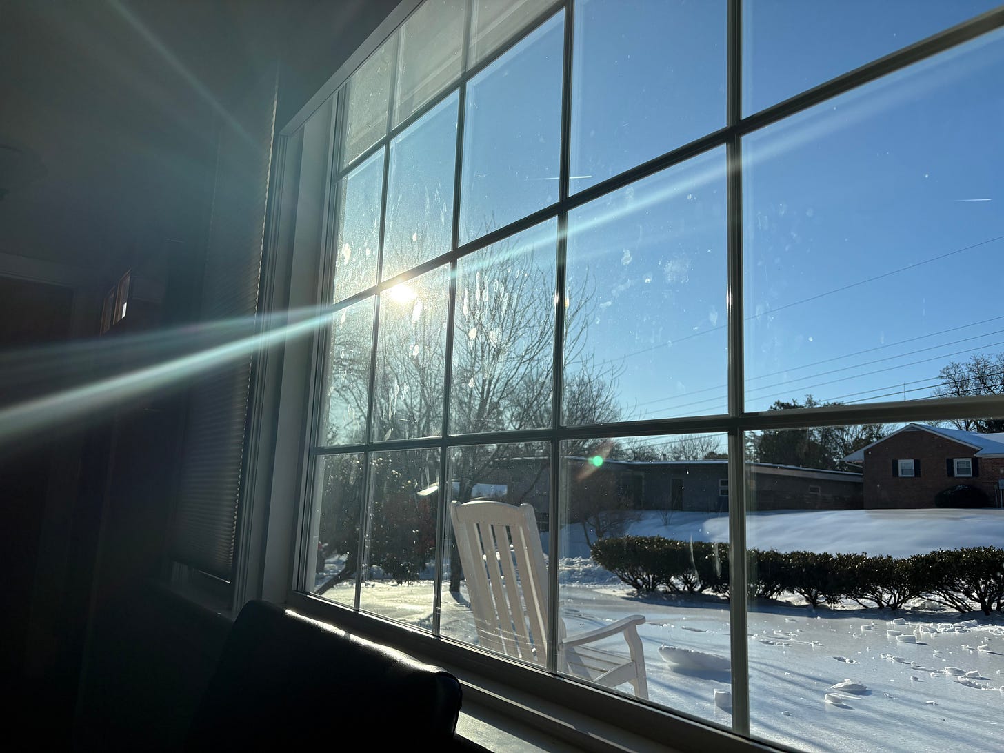photo of sunlight through window and an icy yard