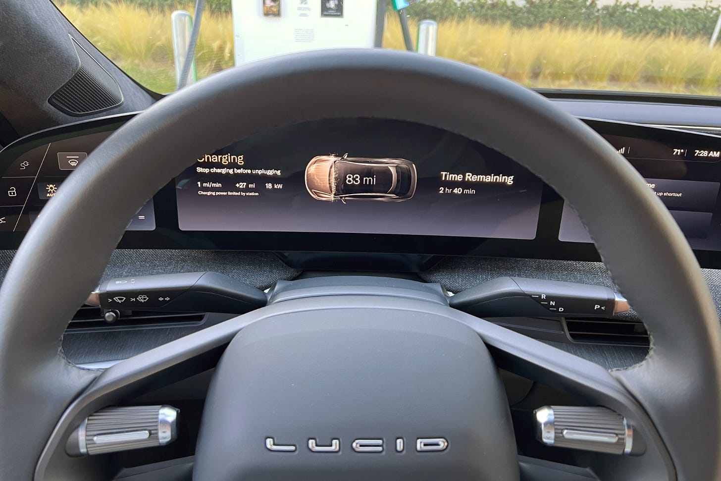 Charging status notification message on the digital instrument panel of a 2023 Lucid Air.