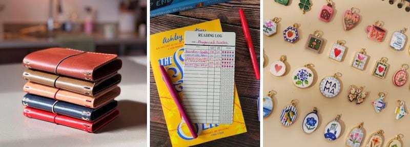 A stack of leather journals, an old-school reading log card insert, and an array of painted charms A stack of leather journals, an old-school reading log card insert, and an array of painted charms