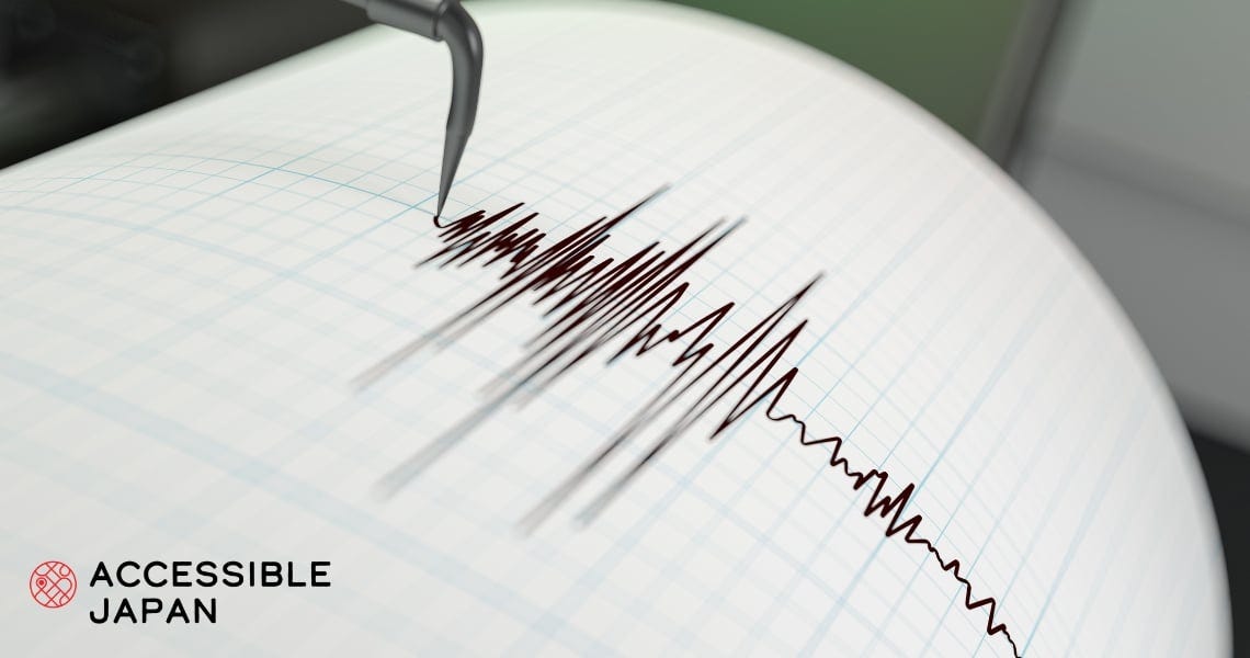 A seismograph needle tracing an earthquake reading onto paper