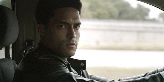 Serano smirking at Cordell WAlker as he chases him in police suv. Serano smirking at Cordell WAlker as he chases him in police suv.