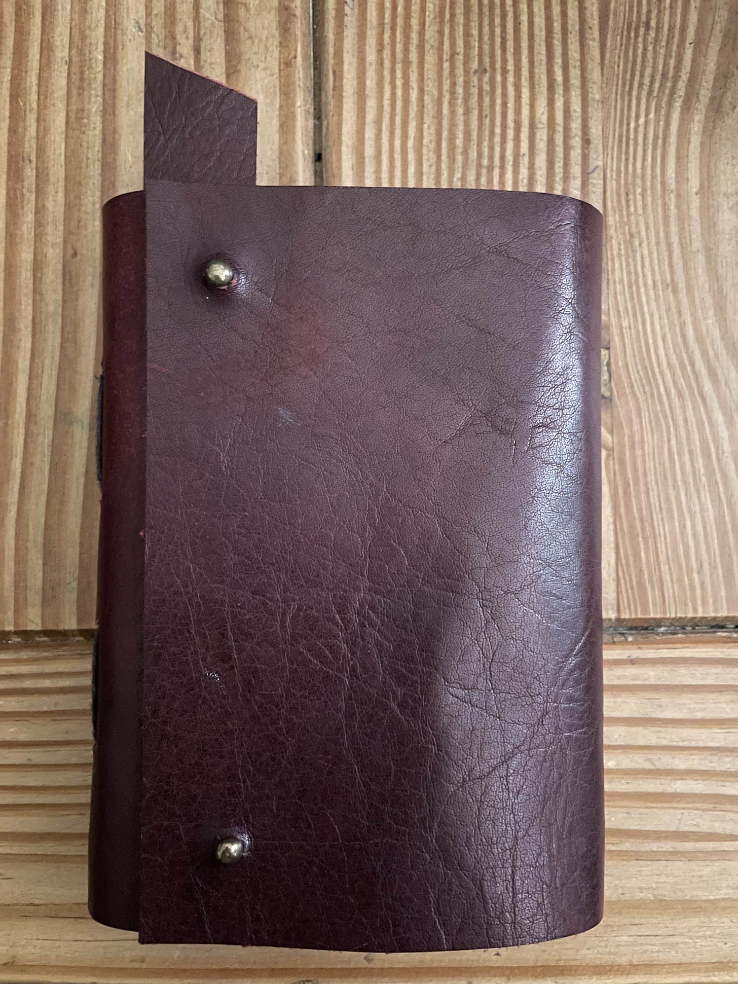 A red leather bound notebook
