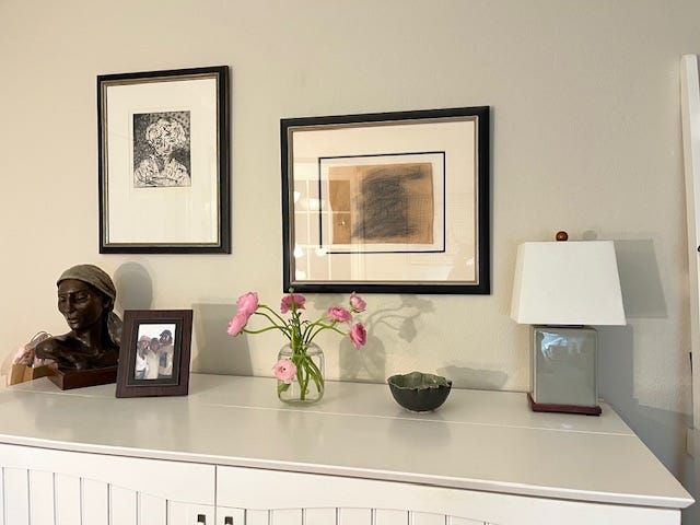 Spring blossoms out the windows, the fabric for the quilt, my sewing machine and the ranunculus in a vase.