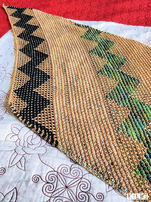 Kentia Wrap in progress with dark green mosaic, multi colored green mosaic and slip stitch sections.